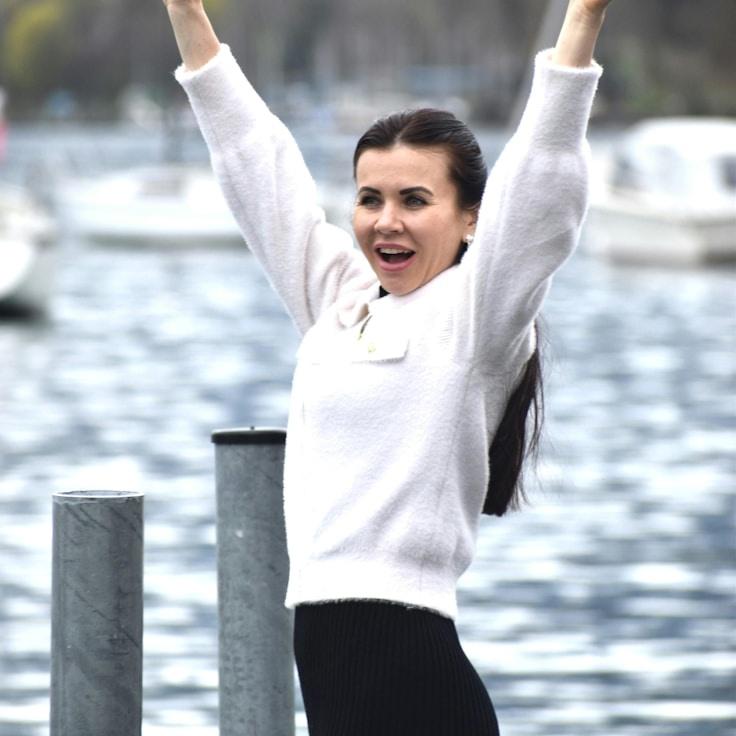 Alex Kim, Lead Design Curator at Terra Vionelix, reviewing corporate floral arrangements